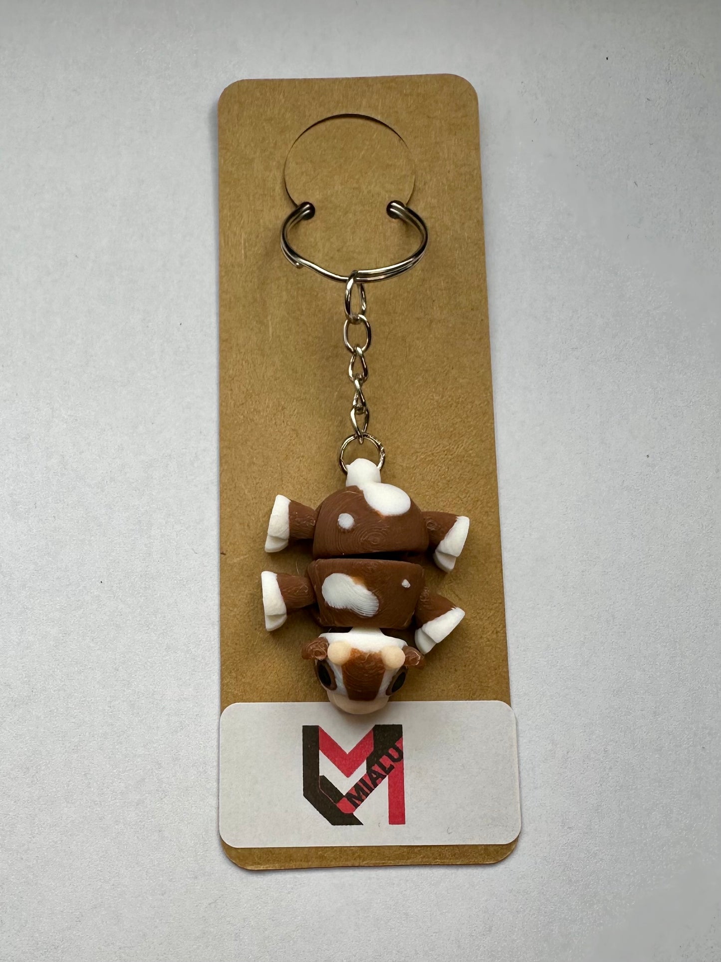 Schlüsselanhänger „Mini-Kuh-Flexi“ braun