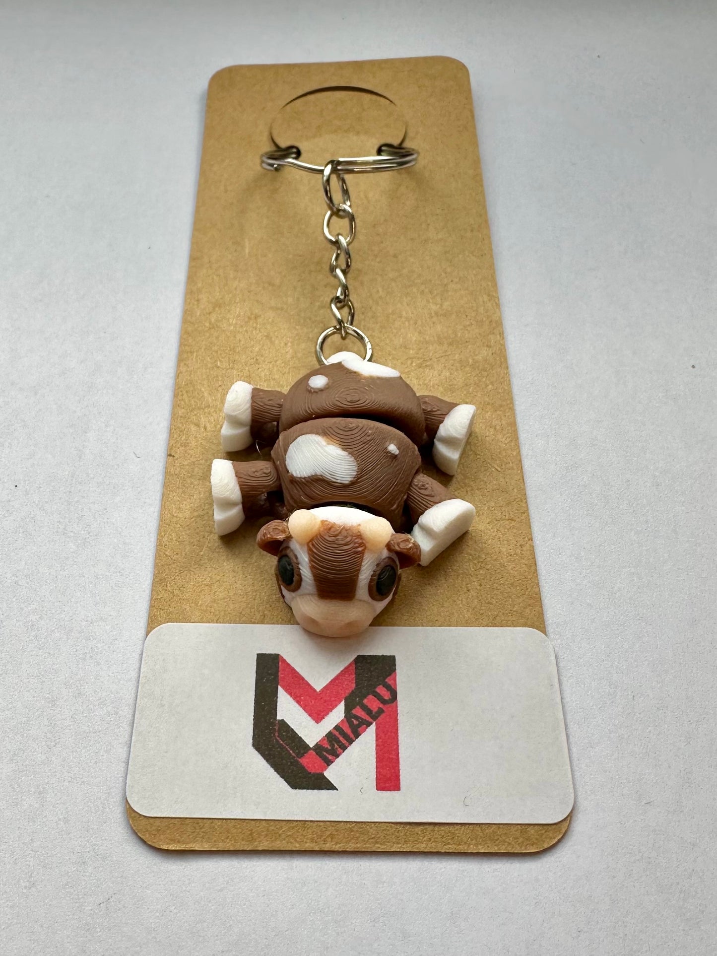 Schlüsselanhänger „Mini-Kuh-Flexi“ braun